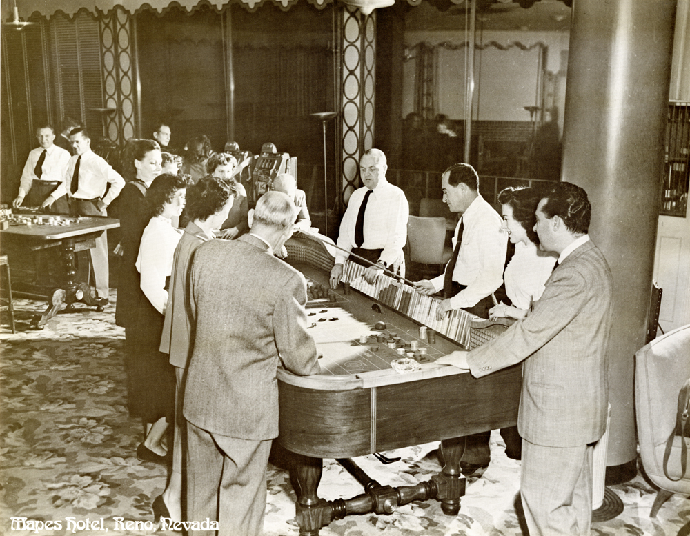 Guests play craps at the Mapes